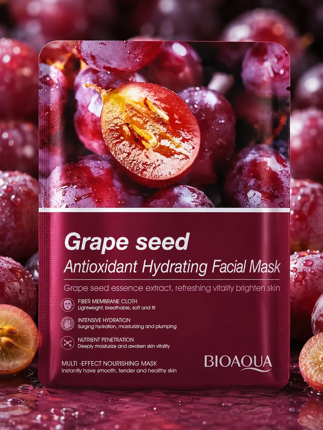 The Bioaqua Grape Seed sheet mask sachet on a bed of wet grapes
