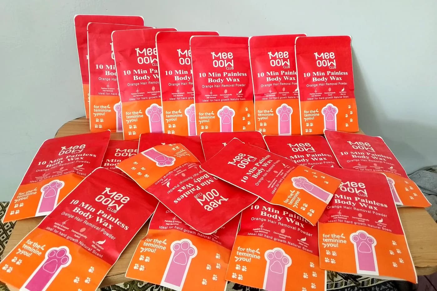 A pile of Meeoow Club body wax packs on a table